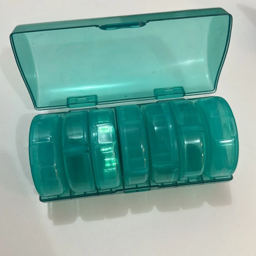Pill organizer has 7 cute containers for each day of the week